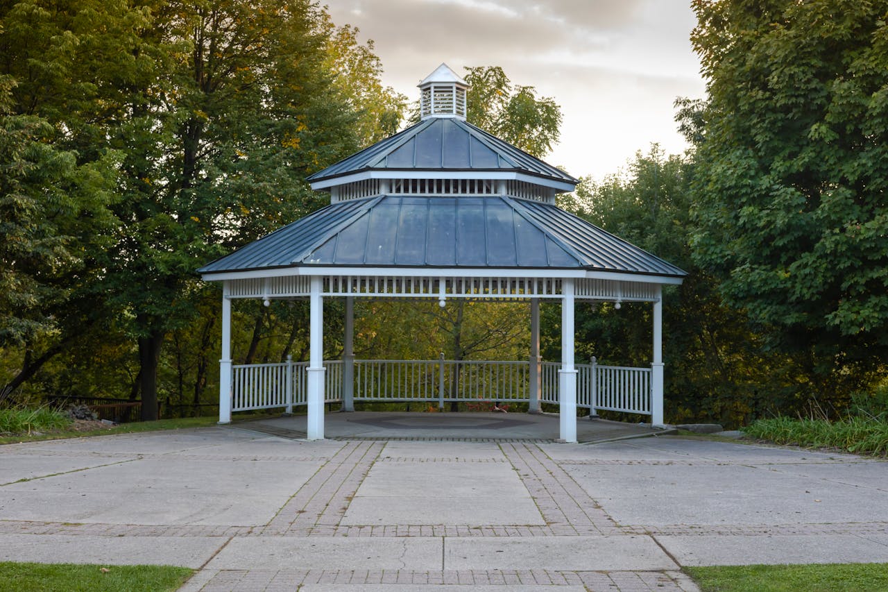 A tranquil gazebo nestled in a lush park setting, perfect for a serene escape.